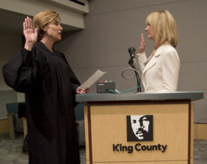 State Senator Patty Kuderer is sworn in by King County Superior Court Presiding Judge Judge Laura Inveen