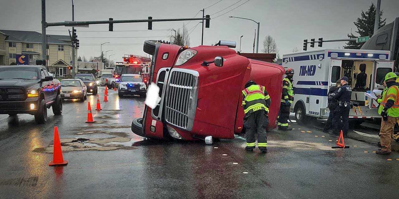 Driver extricated from overturned semi-truck in Kent Tuesday morning